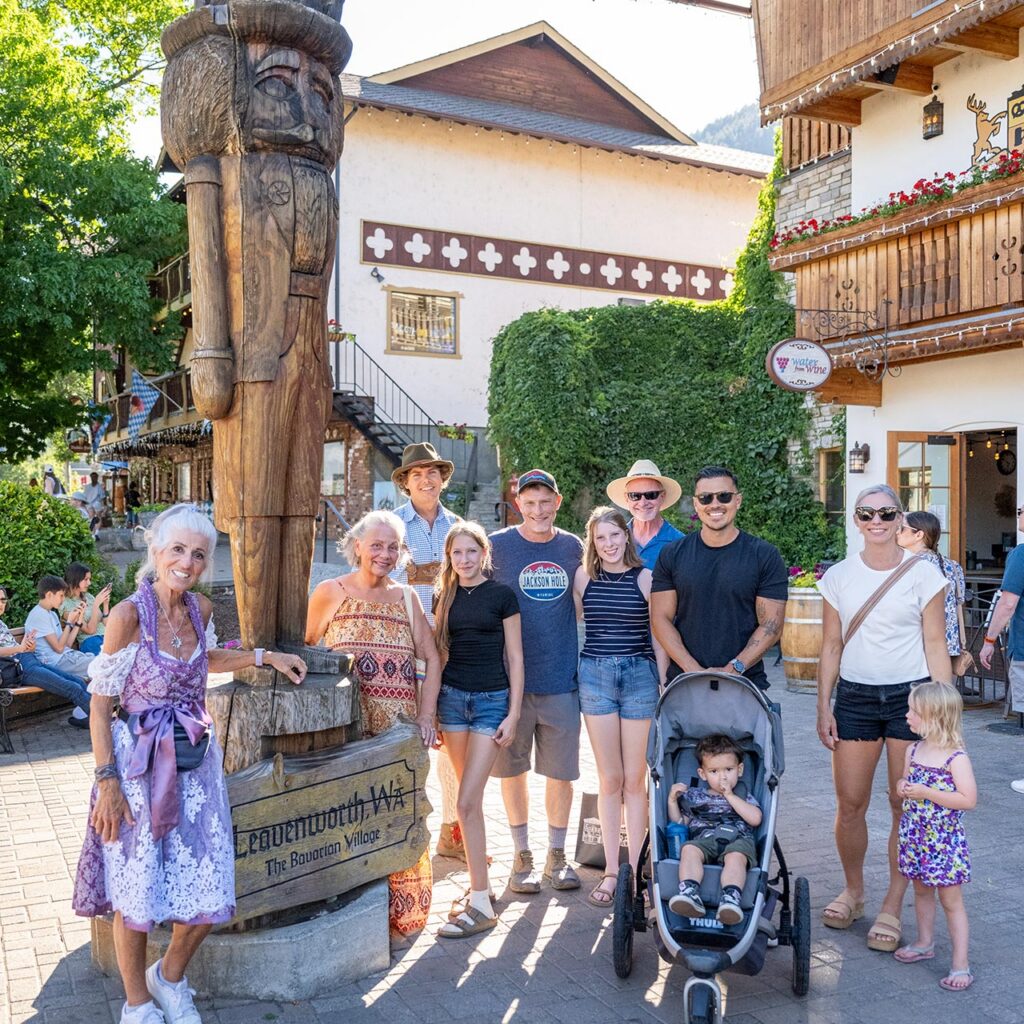 Walking tour group photo in front of the nutcracker statue in Leavenworth, WA